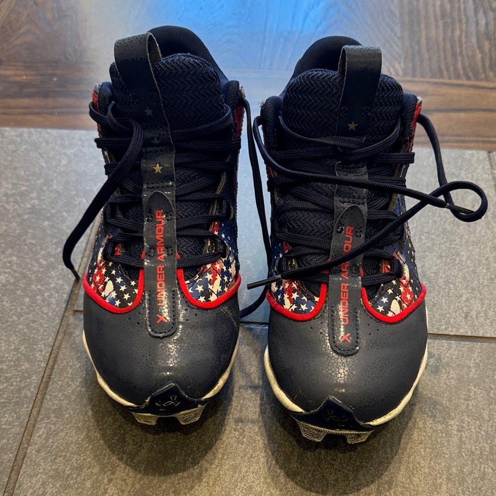 Under Armour Kids Navy Cleats with Red & White Star Accents